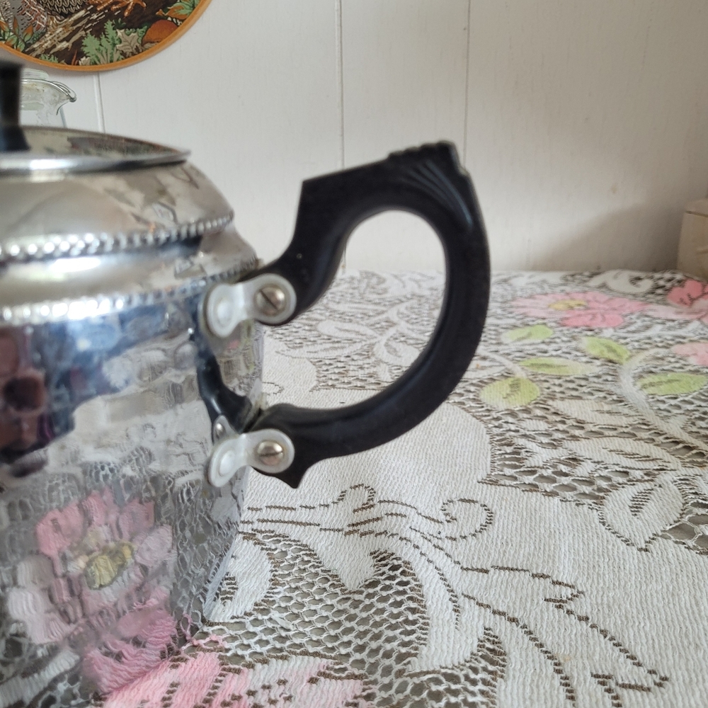 Elegant Silver Teapot with Black Handle - Picture 5 of 9
